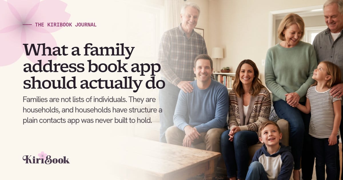 Three generations of a family gathered in a living room, grandparents standing behind a couple on the sofa with two young children